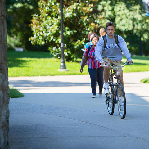 Photo of student riding a bicycle 