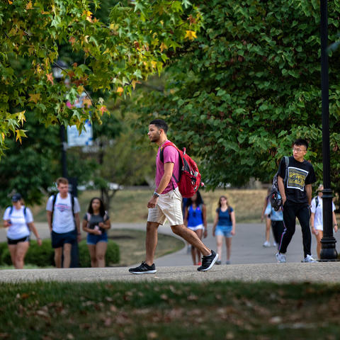 Photo of student walking on campus