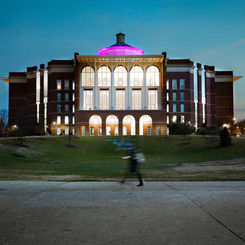 Purple light on William T. Young Library. 