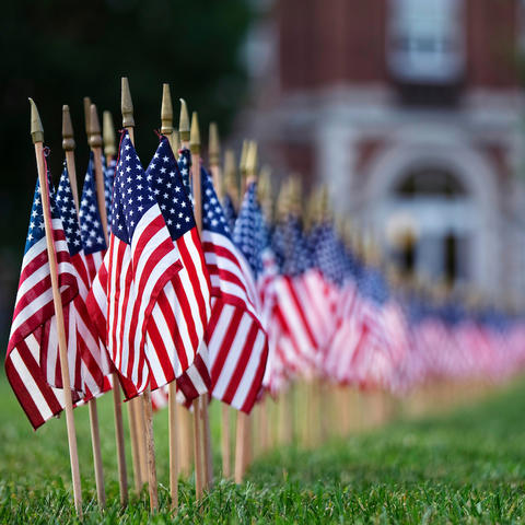 photo of 9/11 flags in front of UK Main Building
