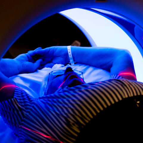 Male patient receiving a CT scan for lung cancer screening