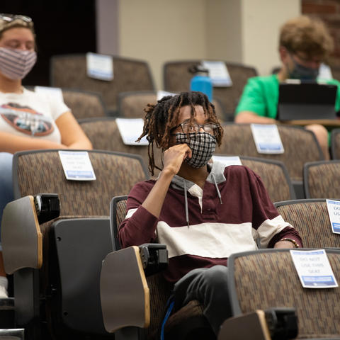 Photo of student sitting in classroom