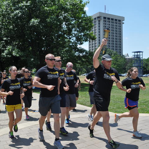 photo of UK Police officers running in Law Enforcement Torch Run in 2014