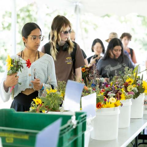 Students picking out flowers
