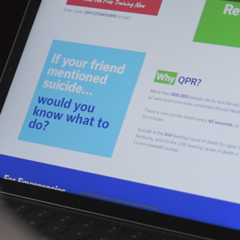 an over-the-shoulder shot of a student looking at the Question, Persuade, Refer website. It says "If your friend mention suicide...would you know what to do?"