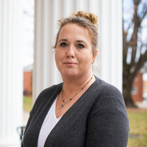 Communications coordinator Rebecca Hurst photographed outside Mandrell Hall, where UK Health Corps is based