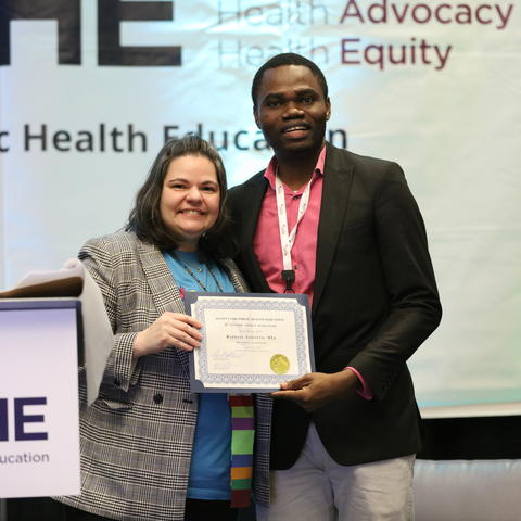 Raphael Adesiyan accepts a 21st Century student scholarship award at the Society of Public Health Education annual conference. Photo submitted. 