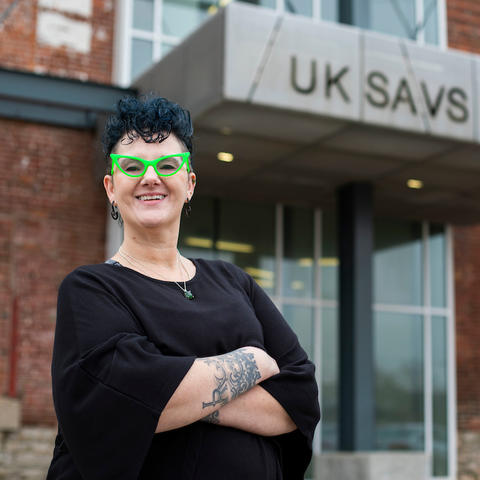 photo of Ambre Armstrong outside the entrance to UK SAVS Building