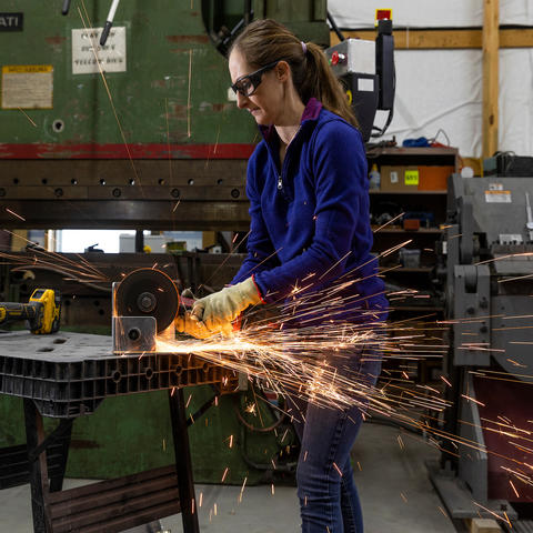 Jessica Moore often helps out in her family's welding shop by grinding metal. This is what she was doing when she first started experiencing symptoms of a stroke.  Arden Barnes | UKphoto
