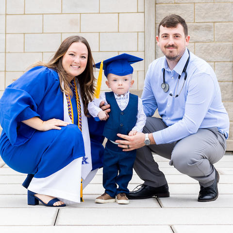 Graduating senior Elizabeth Buckles pictured with her son TJ and husband Tylor