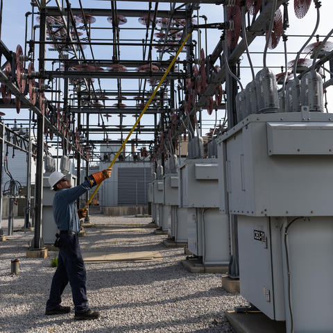 Brian Bayer, a high voltage electrician in Facilities Management, opens a switch at one of the three UK electrical substations. The 19.2% decrease in energy use per square foot includes electricity measured at a campus level at our substations.