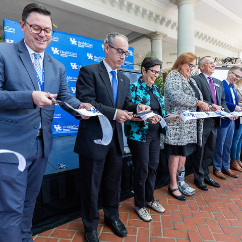 image of people cutting ribbon at new healthcare facility