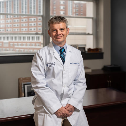 Man in a white lab coat