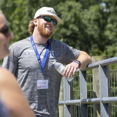 Brock Vandagriff listens to a presentation