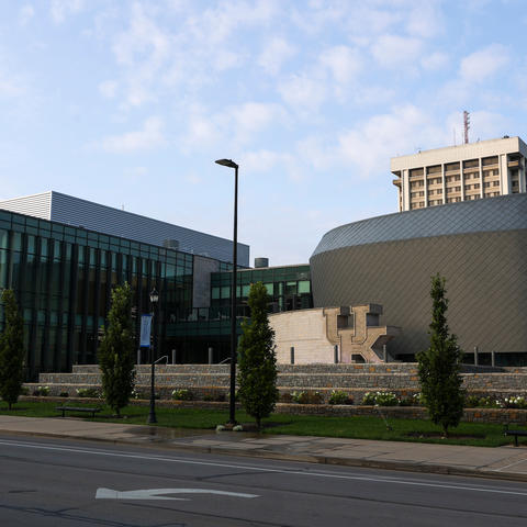 The UK Gatton Student Center view from the sidewalk with the Patterson Office Tower behind it. 