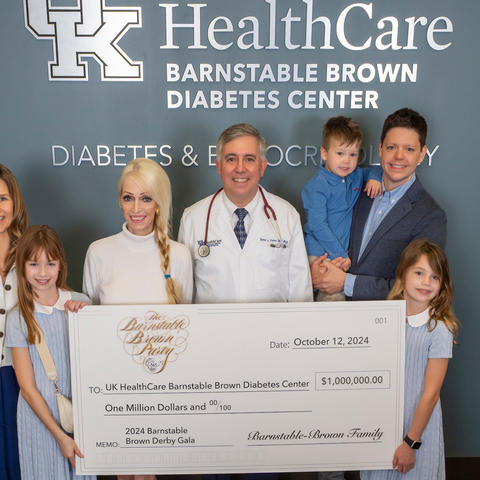The Barnstable Brown family present the 2024 Gala's $1 million donation to Dr. Simon Fisher, director of the Barnstable Brown Diabetes Center. Photo by Mark Mahan.