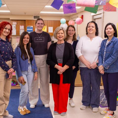 Jennifer Grisham, Ph.D., center, gave a tour of the UK Early Childhood Laboratory to researchers from across the U.S. and around the world during the AEPS Research Symposium. 