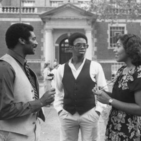 1978 black and white photo of college recruiter Alvin C. Hanley with 2 others on campus