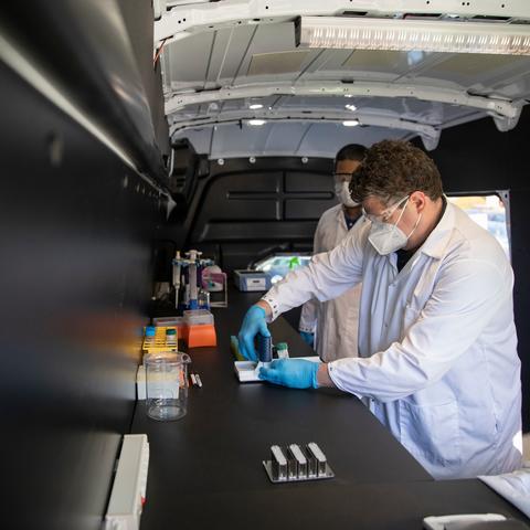 Scott Berry in mobile lab testing wastewater samples