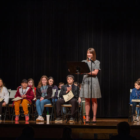 Students on a stage for a spelling bee