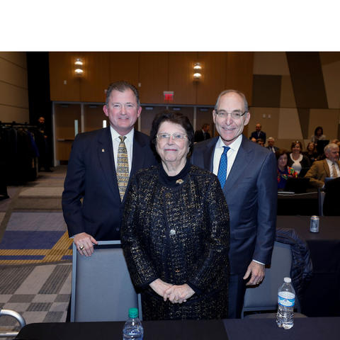 photo of UK Board of Trustees Chair Britt Brockman, philanthropist Mira Ball, and President Eli Capilouto following the board's acceptance of Ball's $10 million gift.  