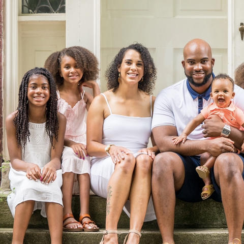 Byron Mitchell (center) pictured with wife Erin D. Mitchell, also a UK grad, and their four children