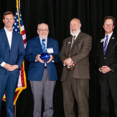 Robert Baumann receives Governor Service Award