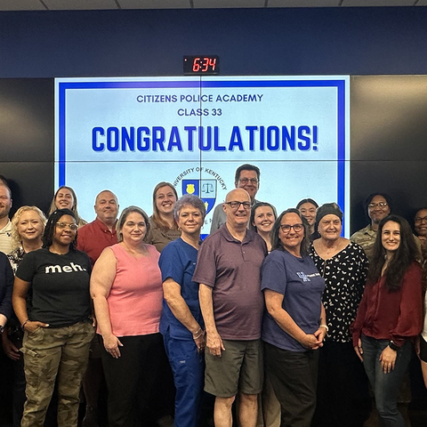 A photo of the 2024 CPA graduating class standing in the Emergency Operations Center