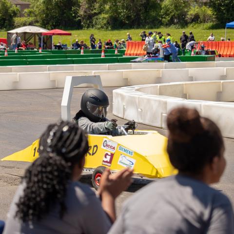 photo of student racing an electric vehicle
