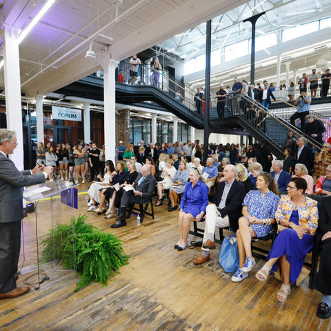 Ned Crankshaw, dean of the College of Design, speaks to a crowd assembled for the building’s ribbon cutting. 