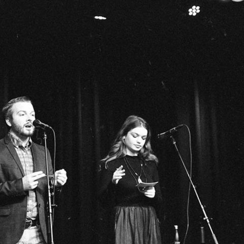 black and white photo of JT Priar and Maddie Marburger presenting at 2018 Fish Tank