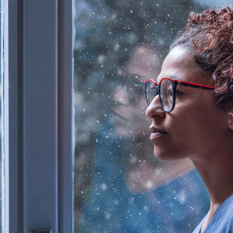 Photo of Woman Looking Out the Window