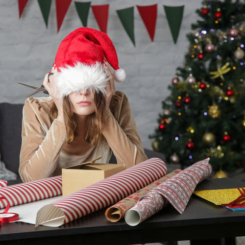 Getty Image of Woman Wrapping Presents