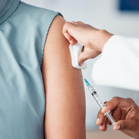 A vaccine is injected into a patient's arm