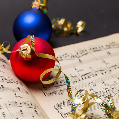 photo of christmas ornaments on sheet music