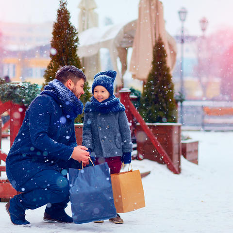 dad and son shopping in snow