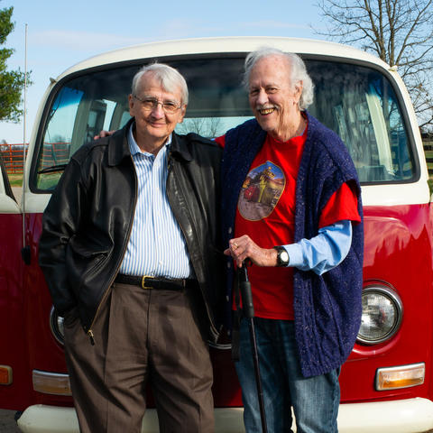 photo of Gurney Norman and Ed McClanahan in front of VW van