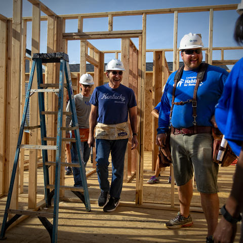 photo showing: Left to Right: Eric Monday, executive vice president for Finance & Administration, UK President Eli Capilouto, Peter Carew, Lexington Habitat for Humanity Director of Construction