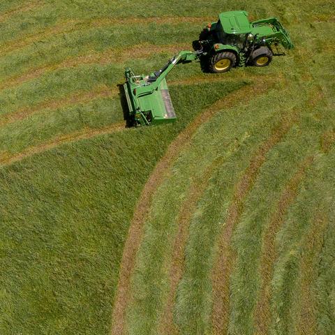 Tractor bailing hay