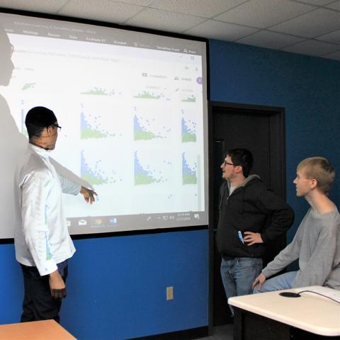 photo of students tracking progress in their competition