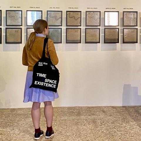 An onlooker observes “Continuous Recovery” on display at the Time, Space, Existence exhibition in Venice, Italy.  Photo by Rebekah Radtke. 