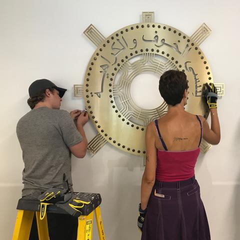 photo of installation of "Unlearn Fear + Hate" sculpture by Kremena Todorova and Kurt Gohde