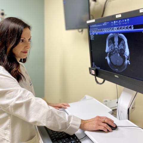 Dr. Beth McNulty, a UK HealthCare neurotologist, looks at a scan. 