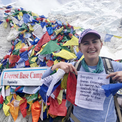 Maya Husayni with prayer flags at Mt. Everest Base Camp