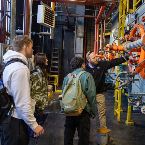 Carter Whitton, utilities systems engineer, spoke with students in Holly Osborn's technical writing course about how resources are used to regulate campus temperature in one of the heating plants. 