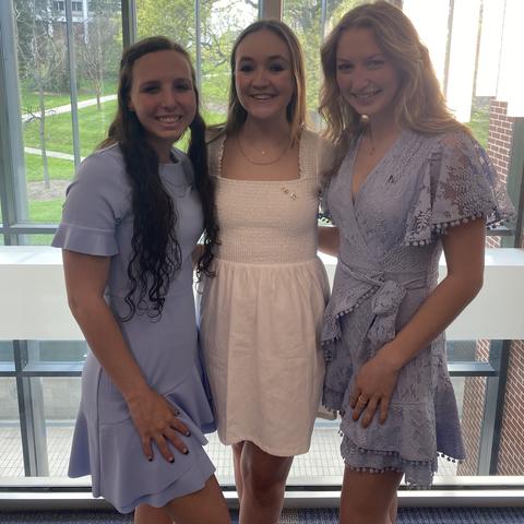 Ainsley Flask, director of programming (left), Savannah Miller, president (middle), and Kelli Burnett, vice president (right) pictured at initiation on April 18, 2021.  