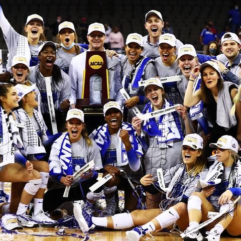 This is a photo of the UK Volleyball team upon winning the NCAA Championship. 