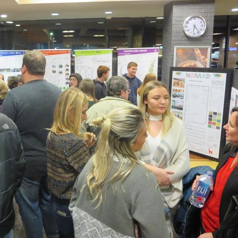 photo of people at Southland Design exhibit at Good Foods Co-op