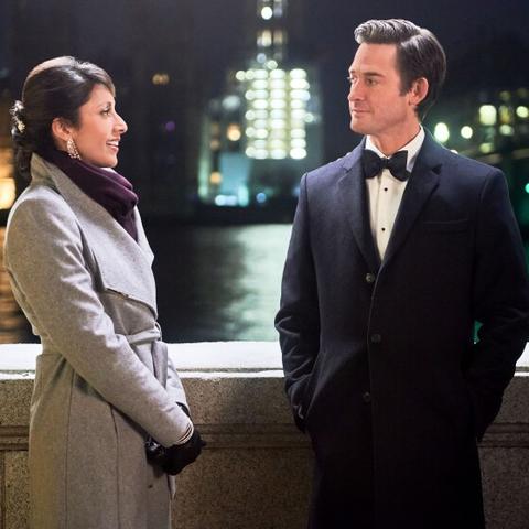 photo still of Reshma Shetty and Will Kemp with London background from "Jolly Good Christmas"