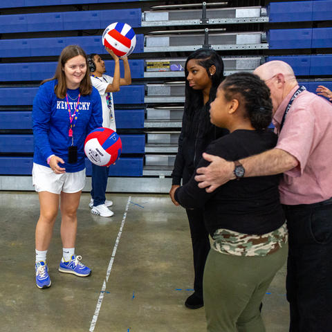  UK senior Kate Tyler (center) works with students in an adapted physical education class at Henry Clay High School.  Photo by Amanda Nelson.